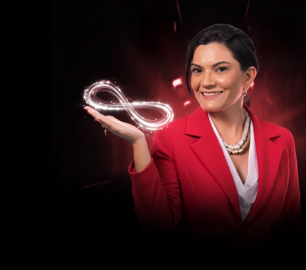 Ludy Sena de blazer vermelho segurando um símbolo do infinito brilhante